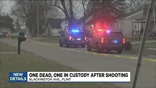 Flint homicide closes city block suspect in custody