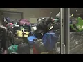 Baggage room at Dulles Airport crammed with passengers things