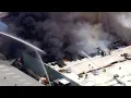 Crews battling warehouse on fire in Fullerton