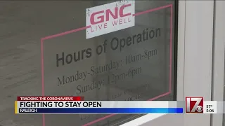 GNC owner complains of non-essential status