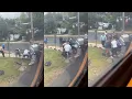 shows bystanders rescue woman from car after it was struck by a Commuter Rail train