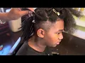 Dreadlock Machine Demonstrates Locs on Long Hair