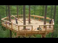 This man is building a giant 10-meter-high treehouse to protect himself from wild animals