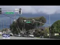 Nearly a dozen power poles toppled on Homestead Road in Santa Clara