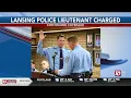 Lansing Police office charged