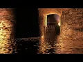 Free Stock Videos – castle ruins on fire with water reflections and particles at night 3D animation