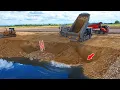 Download Lagu Incredible!, 25.5-ton dump truck fills large lakes and flooded land with KOMATSU Dozer, pushes rocks