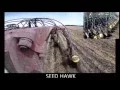 Devloo Roto Mud Scrapers in use on a Seed Hawk