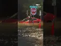 Woman climbs out of car during Fort Worth flooding