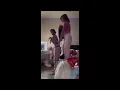 Two girls giving one wedgie