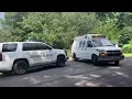 Coroner trucks leave Coweta County home after 4 killed in suspected murder-suicide