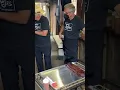 Saucing ribs at Tejas Barbecue