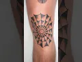 Traditional spider web knee tattoo