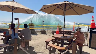 Backwash Waves Break Against Restaurant in Laguna Beach
