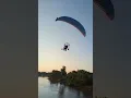 Terrifying moment paraglider hits telephone wires plummets into river