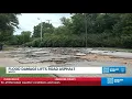 Flood waters lift asphalt off roadway in Waco