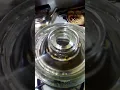 Making coffee with a Pyrex stovetop coffee maker