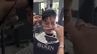 A wavy undercut pixie with fade hair create barber hair style