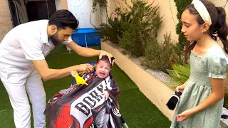 اول مره نحلق شعر كنان تجنن يا حرام ما خلا عمو يقصلو شعرو 