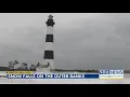 Snow blankets Outer Banks Bodie Island lighthouse