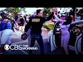 Sheriff takes off riot gear and walks with protesters in Flint Michigan
