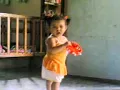 Lia playing tambourine