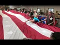 Eder Flag repairs U S flag damaged in Afghanistan
