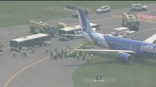 JetBlue plane rolls off runway in Boston