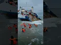 A ferry carrying cars began to sink, and passengers in life jackets jumped into the water