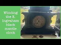 Winding the E Ingraham black mantle clock