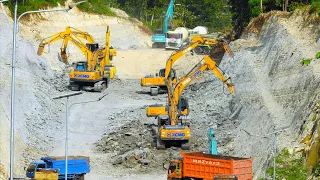 MASSIVE EXCAVATORS CONQUER SOLID STONE HILL! Deep Road Excavation