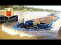 Lagu The cargo barge is overloaded trying to cross dangerous fast water