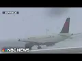 Snowstorm scrubs thousands of flights during busy travel weekend