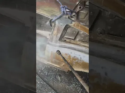 Pulling this 1965 mustang fastback out of the acid and then pressure washing all the rust off.