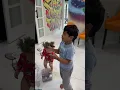 Mom catches daughter and son decorating Christmas tree