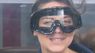 Meteorologist Grace Thornton tests out wind tunnel