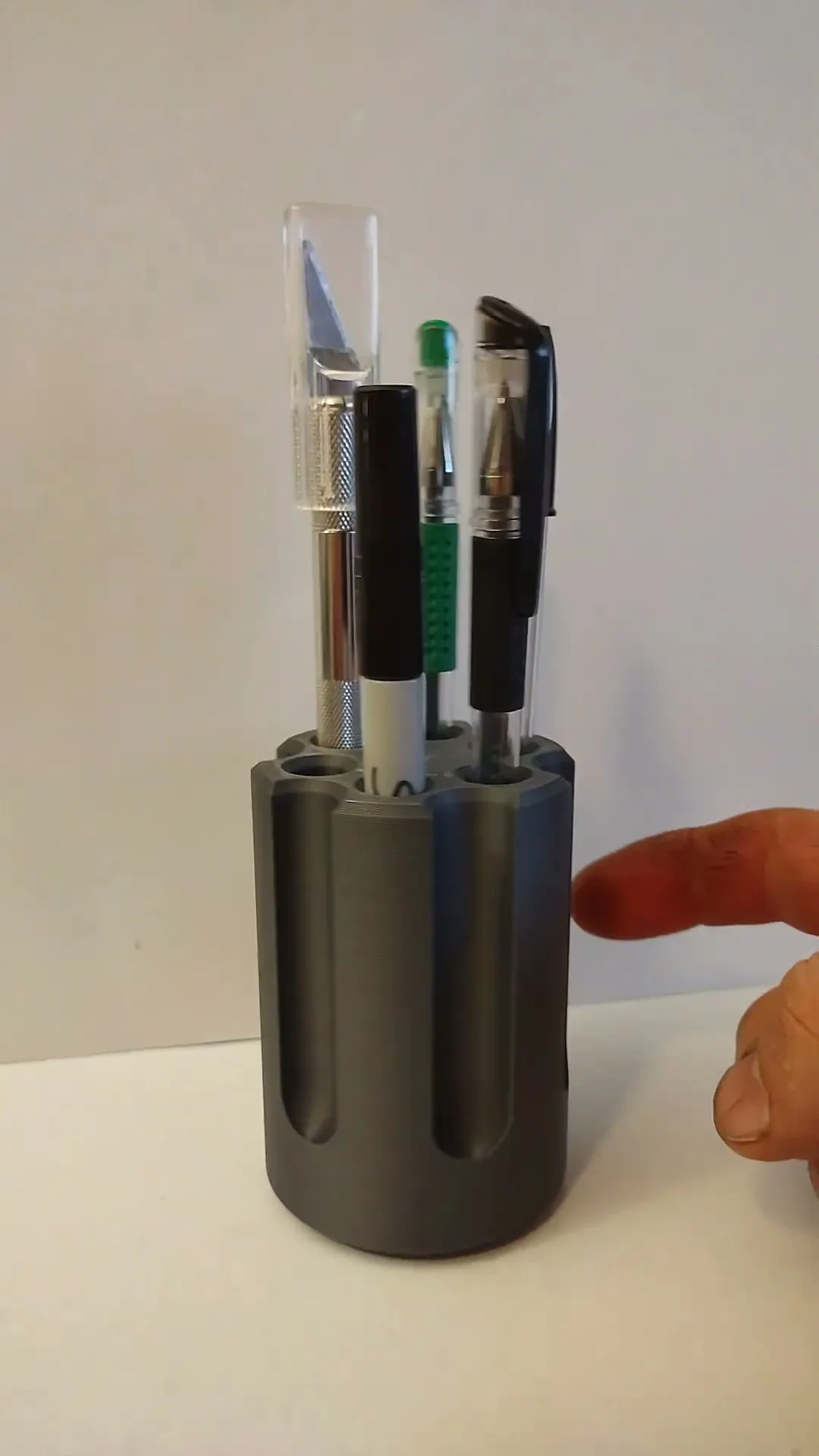 revolver cylinder pen holder with a twist  
