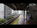 Miami-Dade Transit Dadeland South bound Hitachi Orange Line Train entering Brickell