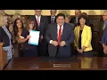 Illinois Governor J B Pritzker signs teacher minimum salary bill