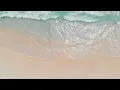 WAVES CRASHING ONTO THE BEACH HIGH ANGLE 4K