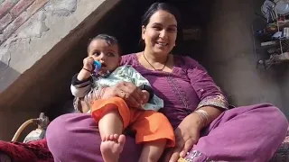 feeding my little daughter while managing household chores