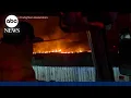 Fast-moving wildfires tear through multiple states