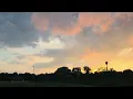 Fast moving scud clouds with toasty sunset
