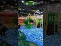 HAPPY KID ENJOY PLAYING SLIDE AT KIDZOONA INDOOR PLAYGROUND