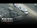 2 semi trucks crash on I-55 spilling steel coils onto roadway