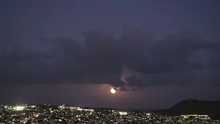 Honolulu moonrise over mountains