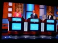 Alex Trebek laughs at a contestant