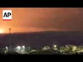 Download Lagu Large explosions in the Gaza Strip light up the night skies