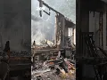 Man rescued after firing a gun inside his burning house