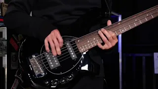 John Myung plays his bass during interview in Thomann s Guitar s Basses
